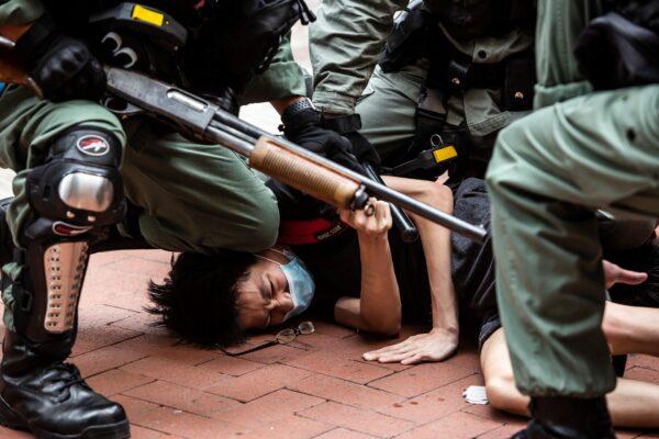 Pro-democracy protesters are arrested by police in the Causeway Bay district of Hong Kong on May 24, 2020. (Isaac Lawrence/AFP/Getty Images)