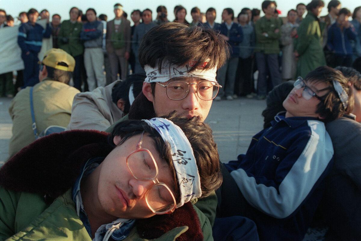 Student hunger strikers from Beijing University relax as several hundred students start an unlimited hunger strike as part of a mass pro-democracy protest against the Chinese government at Tiananmen Square on May 14, 1989. (Catherine Henriette/AFP via Getty Images)