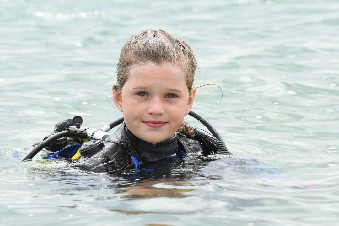 Courageous Schoolgirl Is the ‘Youngest in the World’ to Swim With Sharks Without a Cage