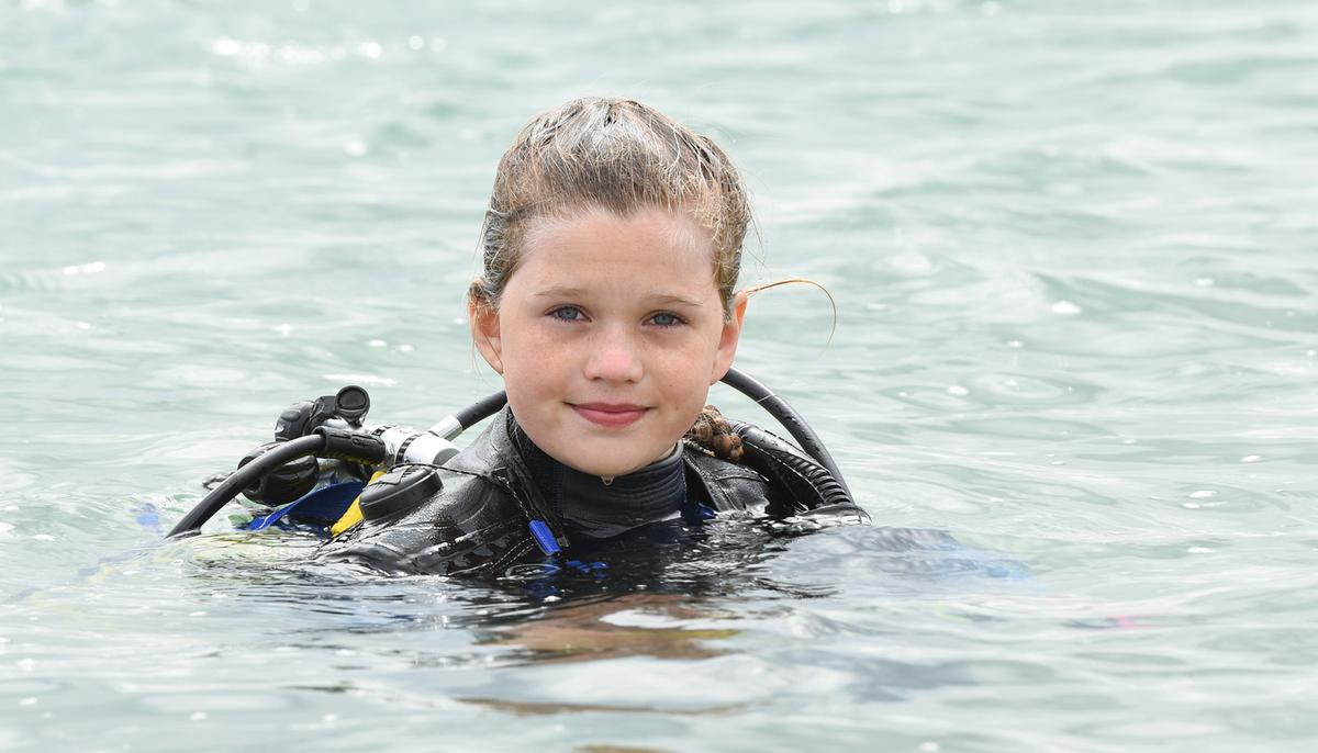 Courageous Schoolgirl Is the ‘Youngest in the World’ to Swim With Sharks Without a Cage