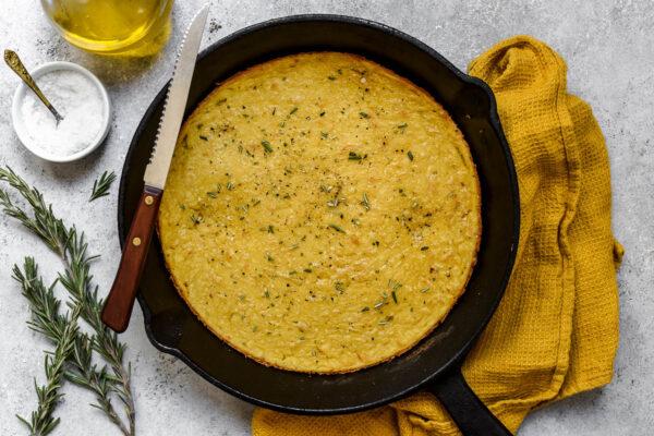 Pour the batter into a preheated pan, bake, and broil until set and slightly charred on the edges. (Audrey Le Goff)