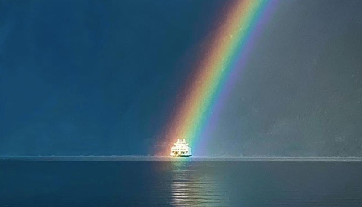 BC Man Captures Perfectly Timed Photo of Ferry Sailing ‘Through’ a Rainbow With iPhone