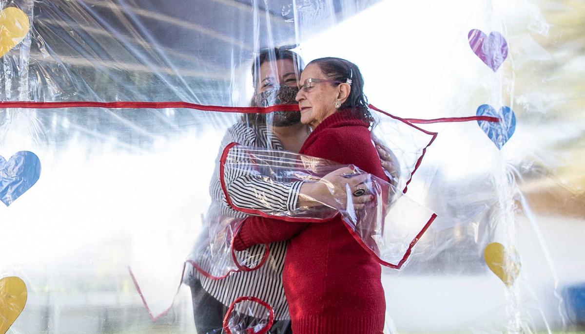 Brazilian Care Home Creates ‘Hug Tunnel’ so Loved Ones Can Embrace Elderly Relatives