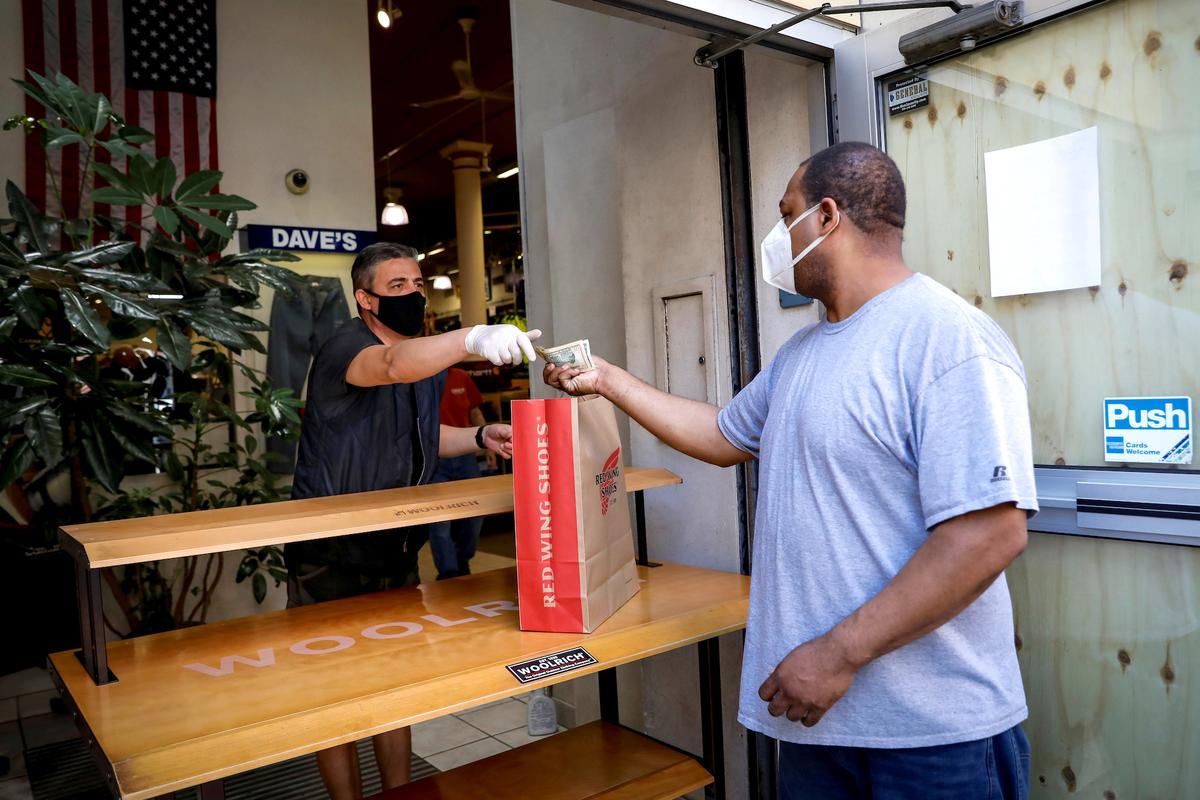 Consumer Spending Surges But Income Falls, Dampening Hopes for Sharp Recovery