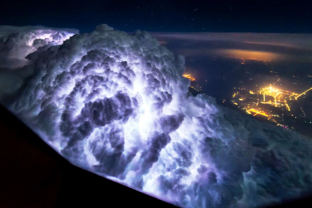 Pilot Photographs Storm Clouds, Lightning, Northern Lights in Flight–and the Results Are Epic
