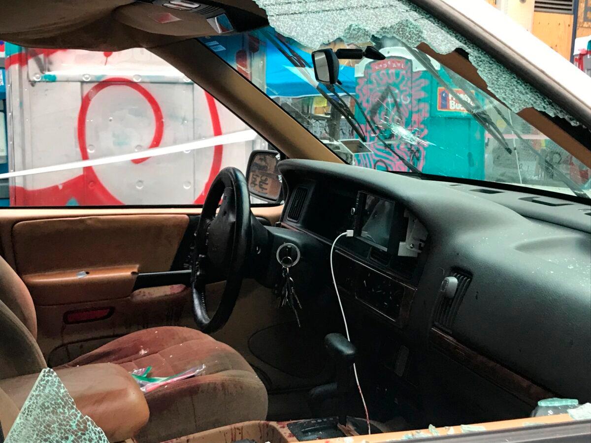 A car sits in the Capitol Hill Organized Protest zone following a shooting in Seattle early June 29, 2020. (Aron Ranen/AP Photo)