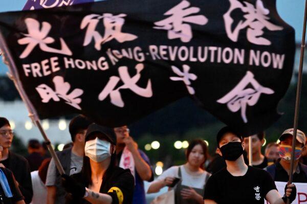 A demonstrator waves a flag during a rally to show support for Hong Kong pro-democracy protests at Free Square in Taipei, Taiwan, on June 13, 2020. (Sam Yeh/AFP/Getty Images)
