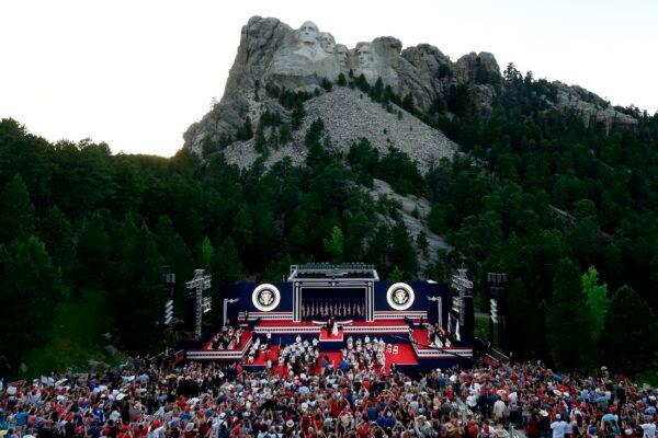 President Donald Trump and First Lady Melania Trump arrive onstage during an Independence Day event at Mount Rushmore in Keystone, South Dakota, July 3, 2020. (Saul Loeb/AFP via Getty Images)