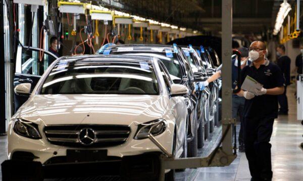 Workers inspect newly assembled cars at a Beijing Benz Automotive Co. Ltd factory, a German joint venture company for Mercedes-Benz, in Beijing on May 13, 2020. (Ng Han Guan/AP Photo)