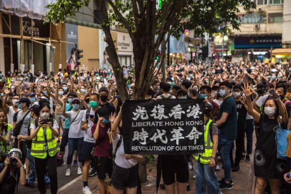 Protesters chant slogans during a rally against a new national security law in Hong Kong on July 1, 2020, on the 23rd anniversary of the city's handover from Britain to China. (Dale de la Rey/AFP via Getty Images)
