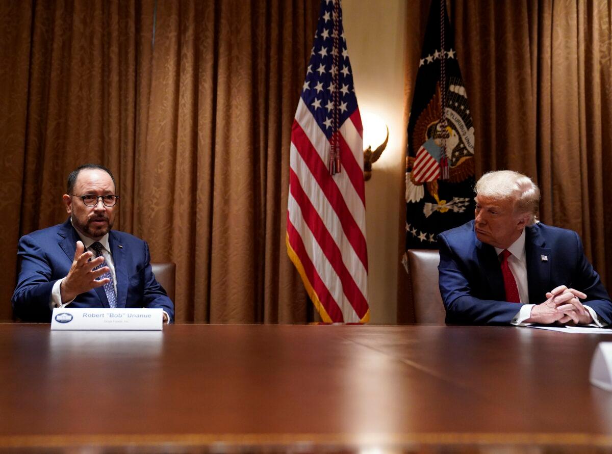President Donald Trump listens as Robert Unanue, of Goya Foods, speaks during a roundtable meeting with Hispanic leaders in the Cabinet Room in Washington on July 9, 2020. (Evan Vucci/AP Photo)