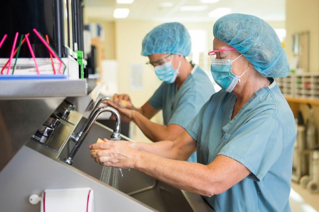 Amid Surge, Hospitals Hesitate to Cancel Nonemergency Surgeries