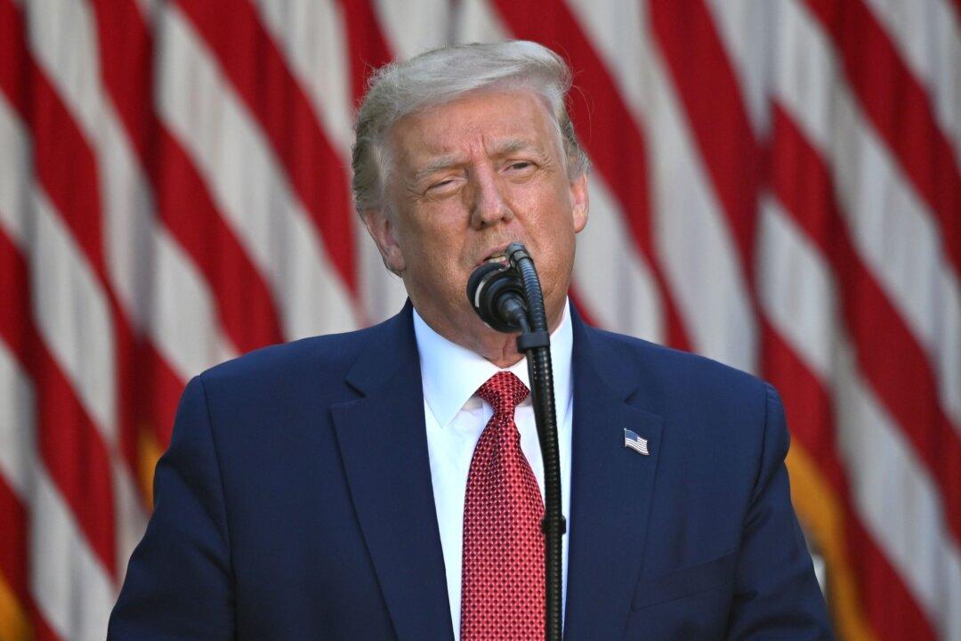 Trump Signs Law to Sanction Chinese Officials, Banks Over Hong Kong Abuses