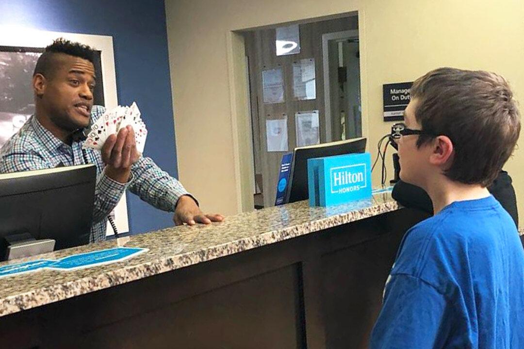 Hotel Worker and Boy With Autism Bond Over Card Tricks, Mom Pens ‘Thank You’ Note