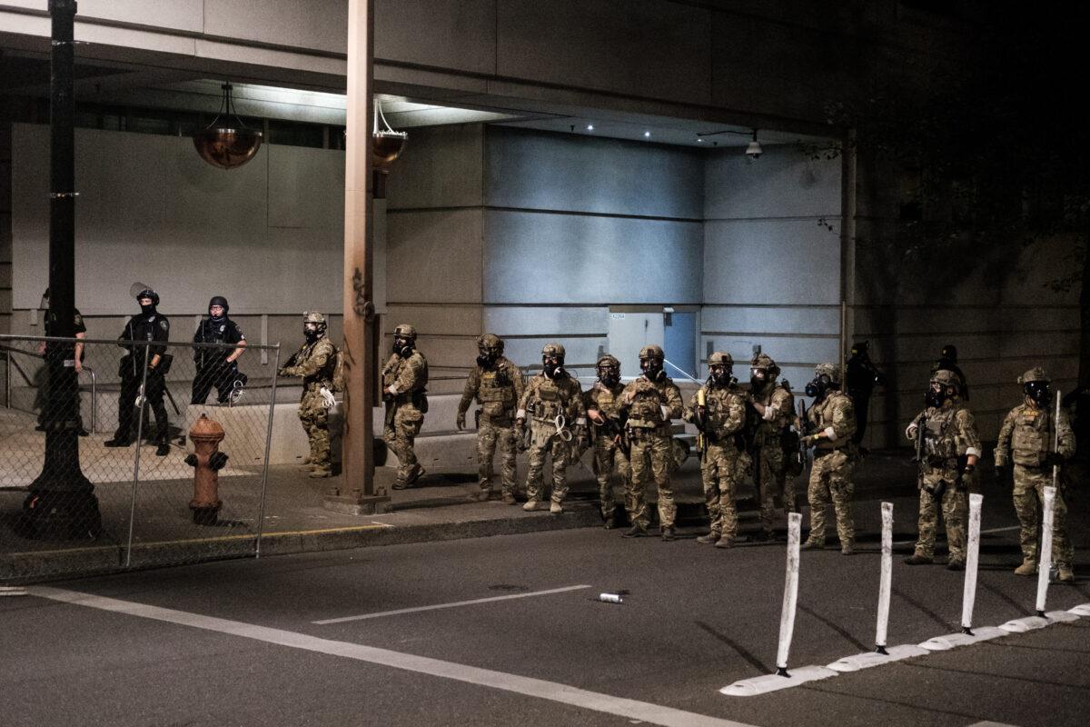 Federal officers prepare to disperse the crowd of protesters outside the Multnomah County Justice Center in Portland, Ore., on July 17, 2020. (Mason Trinca/Getty Images)