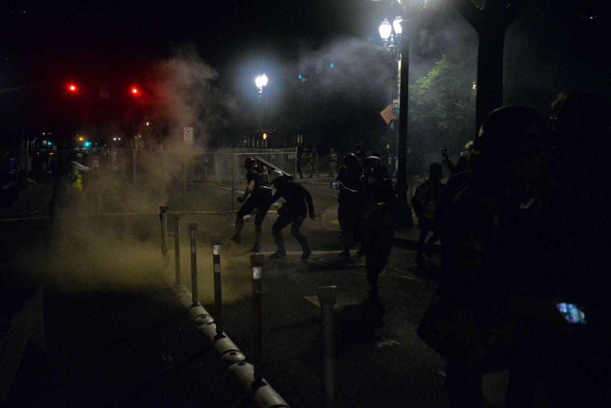 Federal police use CS gas and pepper spray on rioters in Portland, Ore., on July 17, 2020. (Ankur Dkholakia/AFP via Getty Images)