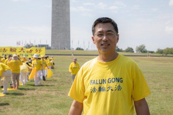 Falun Gong practitioner Xue Bin attends the group exercises in front of the Washington Monument in Washington, D.C. on July 19, 2020. (Lynn Lin/The Epoch Times)