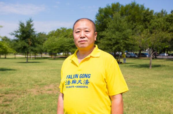 Falun Gong practitioner Wang Hong attends the group exercises in front of the Washington Monument in Washington, D.C. on July 19, 2020. (Lisa Fan/The Epoch Times)