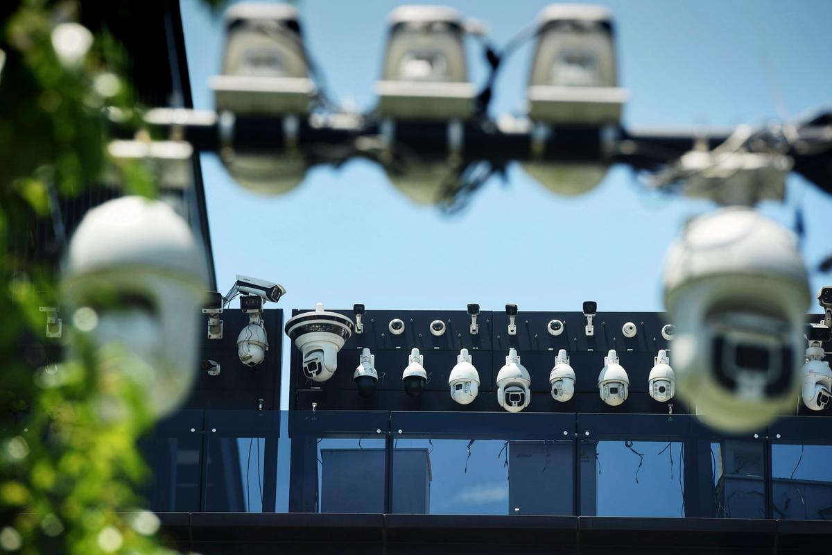 China Installs Cameras Inside People’s Homes, Expanding Its Surveillance Network