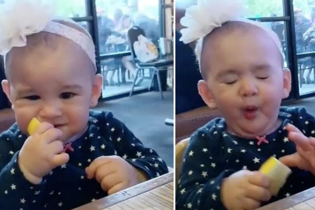 Baby Eats Lemon for First Time, Makes Hilarious Sour Face–and Keeps Going Back for More!
