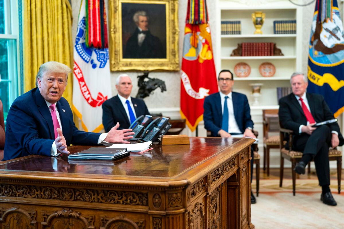 President Donald Trump talks to reporters while hosting (2nd L–R) Vice President Mike Pence, Treasury Secretary Steven Mnuchin, White House Chief of Staff Mark Meadows, and Republican congressional leaders in the Oval Office at the White House on July 20, 2020. (Doug Mills-Pool/Getty Images)