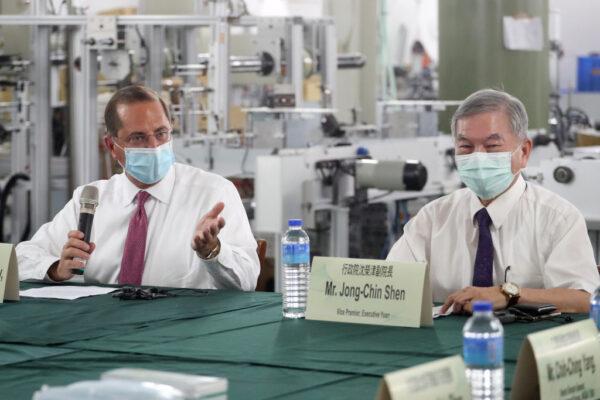 US Secretary of Health and Human Services Alex Azar (L) speaks as Taiwan's Deputy Premier Shen Jong-chin (R) listens during a visit of a mask factory in the Wugu District in New Taipei City on Aug. 12, 2020. (Pei Chen/AFP via Getty Images)
