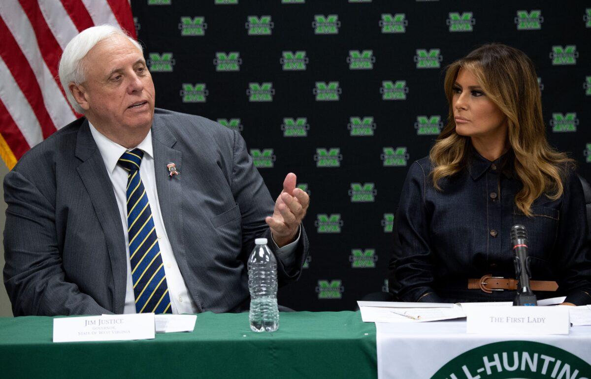 West Virginia Gov. Jim Justice (L), attends a roundtable with First Lady Melania Trump in Huntington, W.Va., on July 8, 2019. (Saul Loeb/AFP via Getty Images)