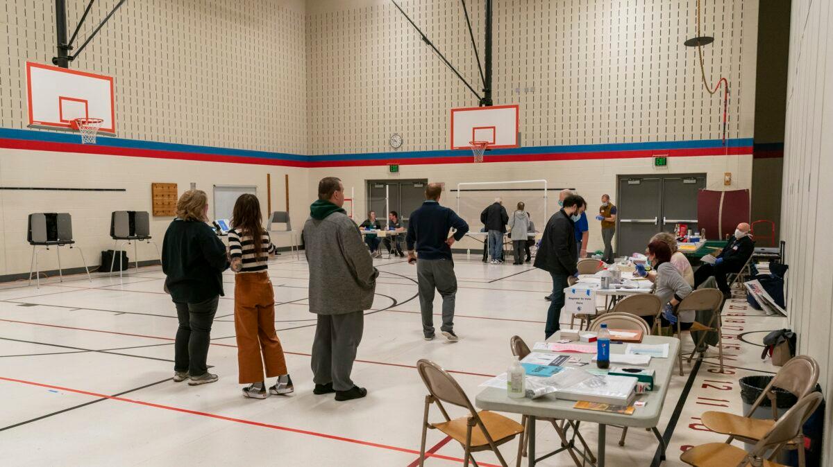 People line up to vote at a polling place in Madison, Wis., on April 7, 2020. (Andy Manis/Getty Images)