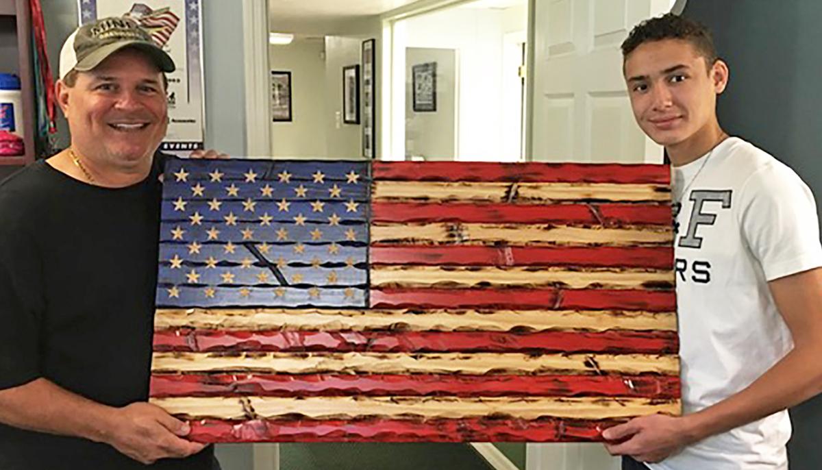 Teen Carves Wooden Flags to Raise Money for Forgotten Veterans and Medical Heroes