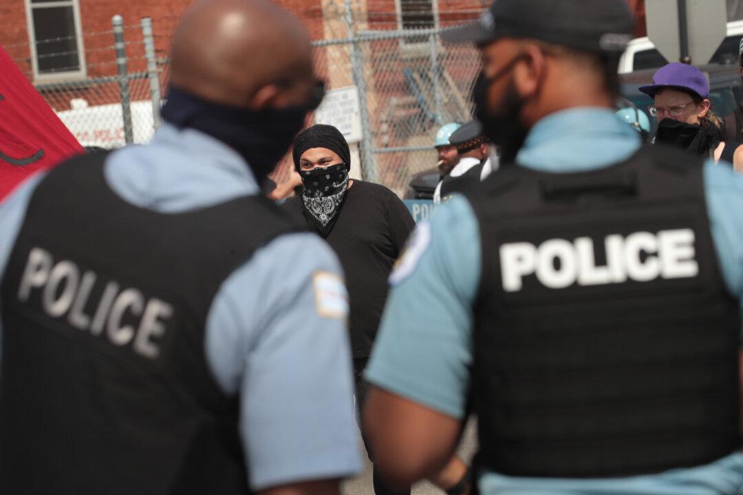 17 Officers Hurt, 24 People Arrested as Demonstrations Turn Violent in Chicago