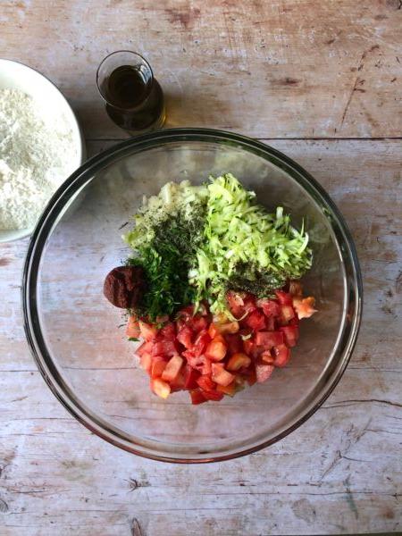 Fritter ingredients include lots of fresh tomato and zucchini, tomato paste for extra flavor, and fresh herbs for brightness. (Courtesy of Helen and Billie Bitzas)