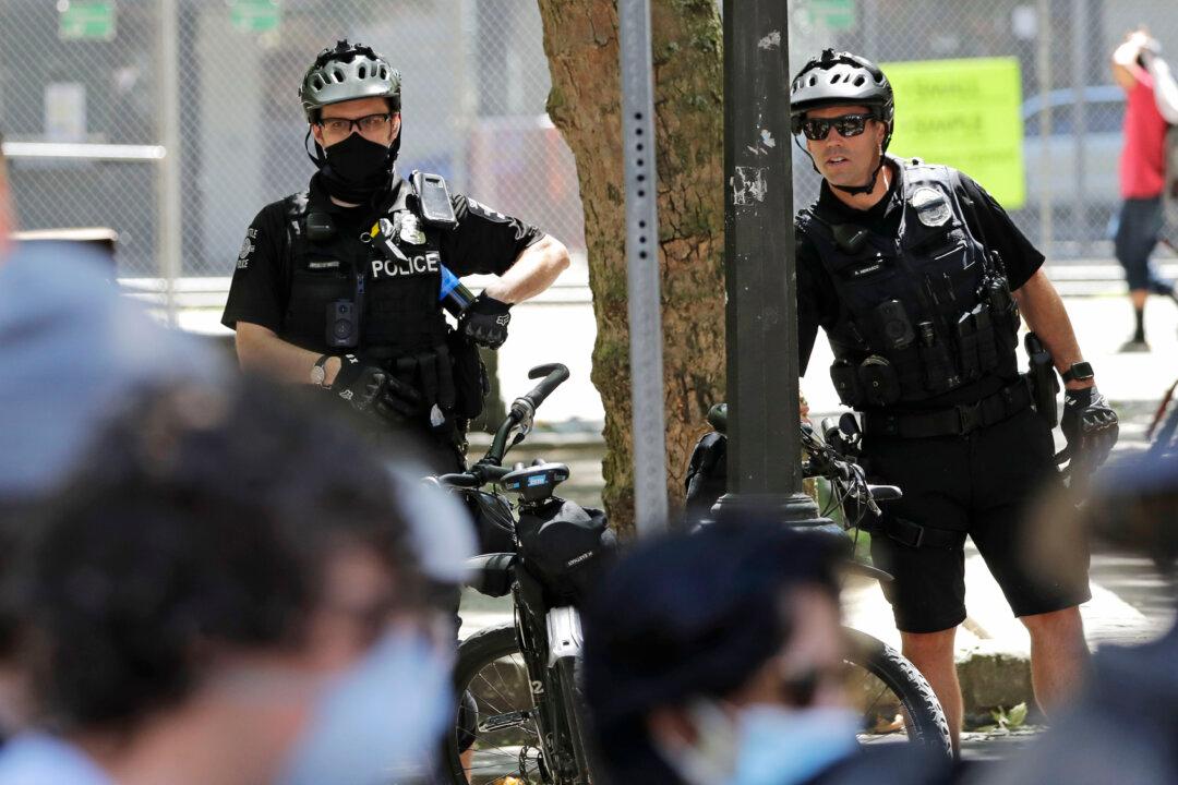 18 Arrested After Rioting in Seattle, Six Officers Injured