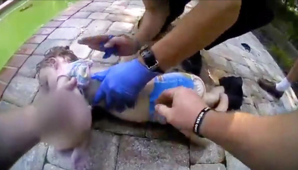 Bodycam Shows Nerve-Grinding Footage of Officers Rescuing 3-Year-Old Floating in Pool