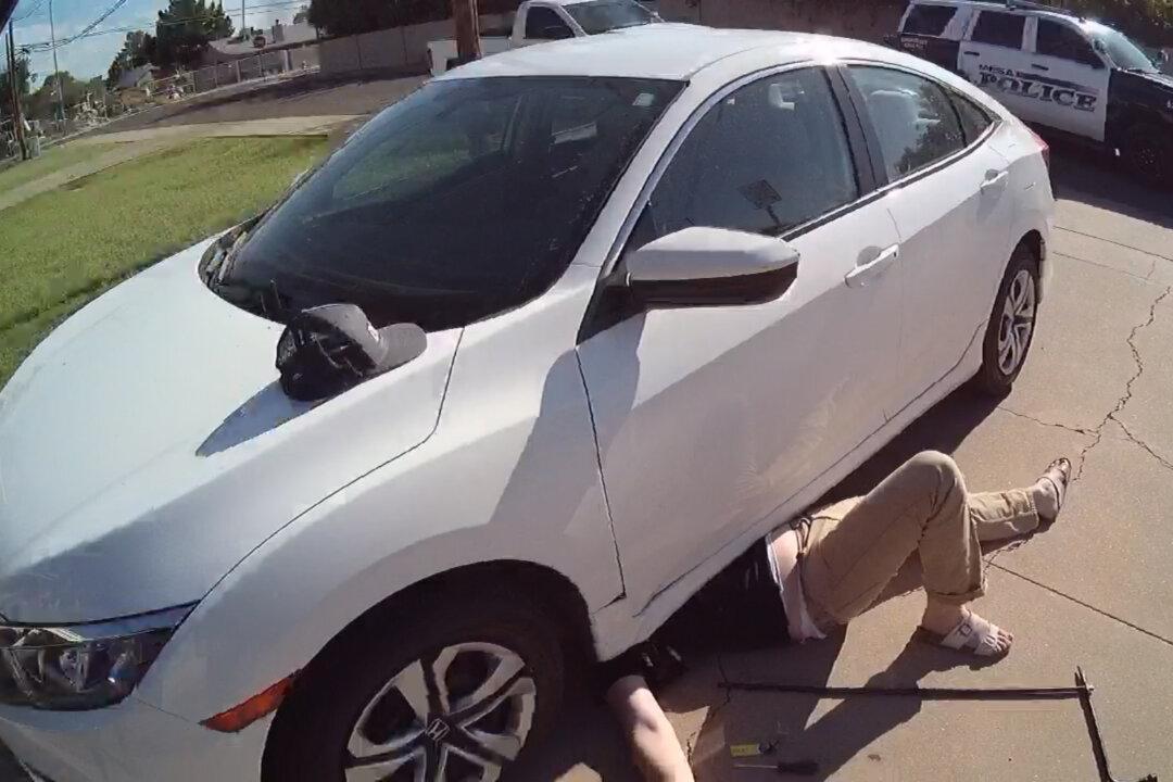 Bodycam Shows Moment Police Officers Lift 3,000lb Car Off Trapped Arizona Man