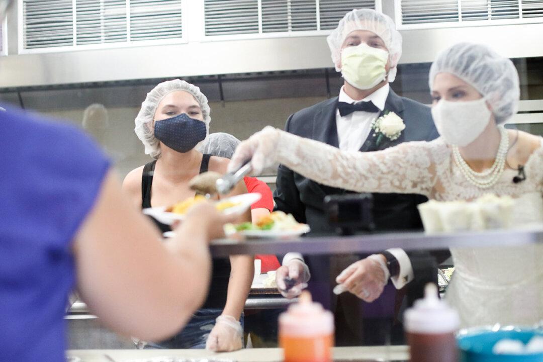 Newlyweds Donate and Serve Canceled Wedding Reception Food to a Local Women’s Shelter