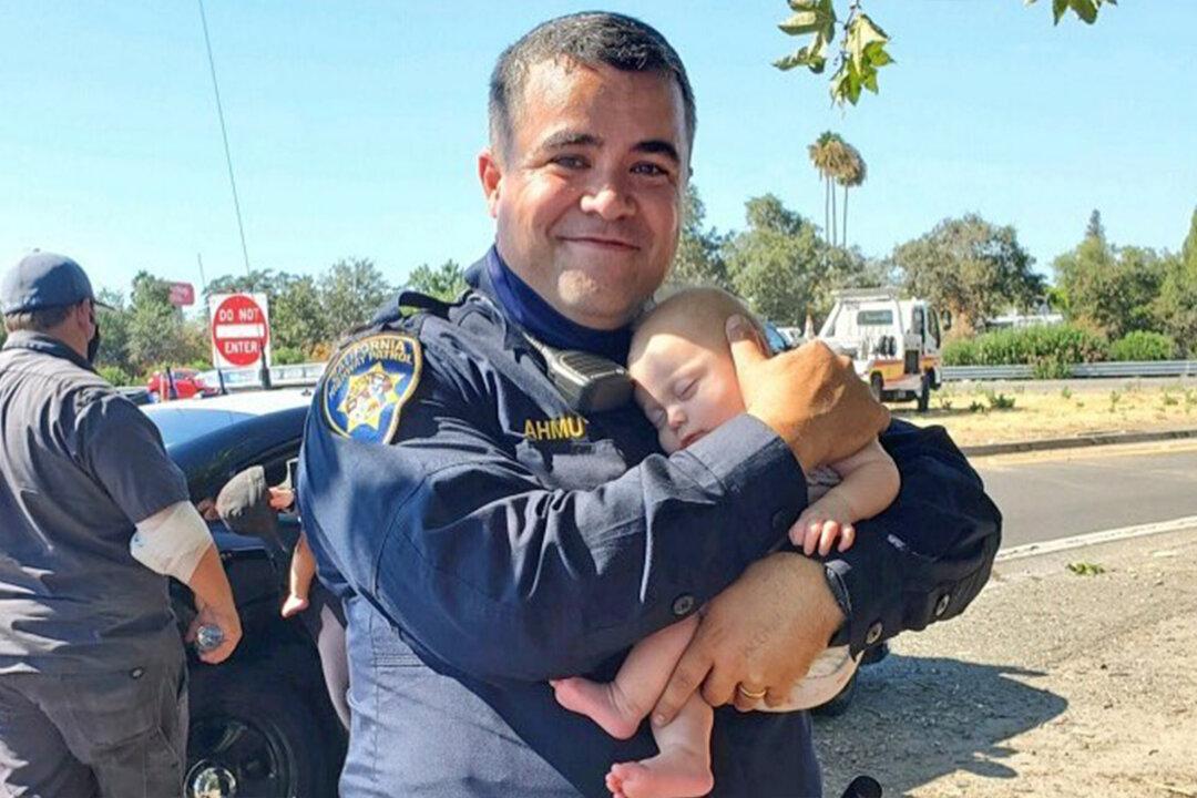 Heartwarming Picture Captures a CHP Officer Holding a 6-Week-Old Baby After a Car Crash