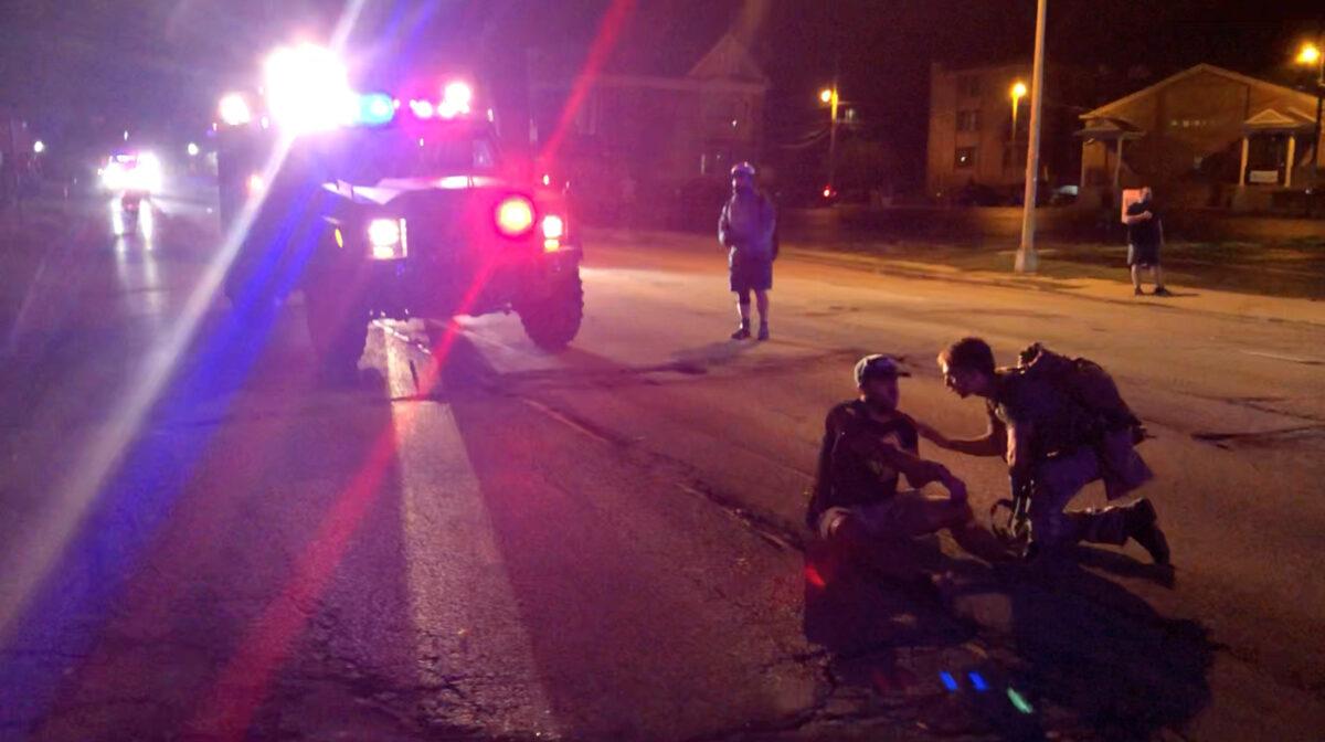 A man is wounded by gunfire amid rioting in Kenosha, Wis., on Aug. 25, 2020. (@Louriealex/Instagram via Reuters)