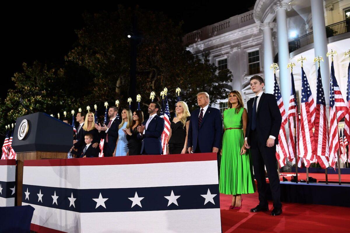 (From R) Barron Trump, First Lady Melania Trump, President Donald Trump, Tiffany Trump, Donald Trump Jr., Kimberly Guilfoyle, Lara Trump, Eric Trump, Ivanka Trump, and Jared Kushner stand after the president delivered his acceptance speech for the Republican Party nomination for reelection during the final day of the Republican National Convention at the South Lawn of the White House in Washington, on Aug. 27, 2020. (Brendan Smialowski/AFP via Getty Images)