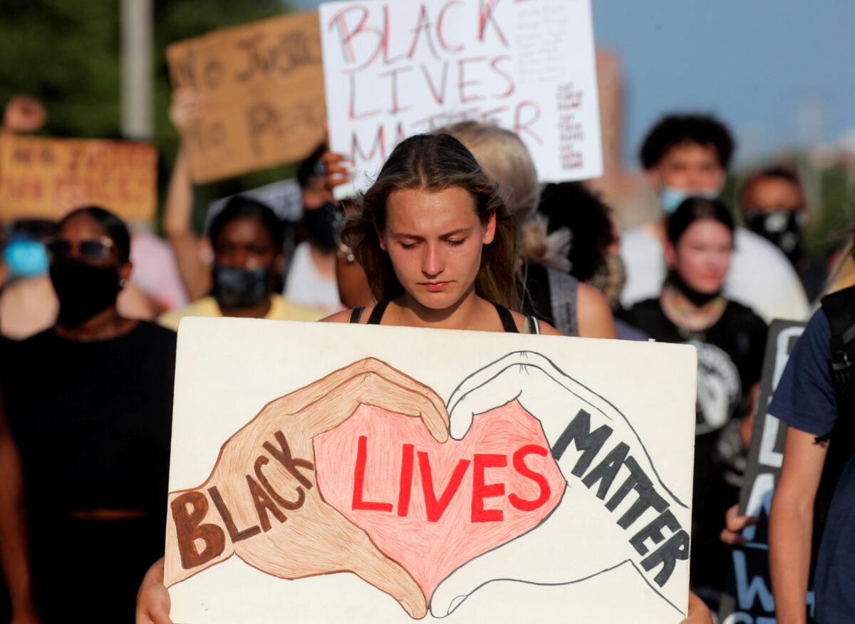 People march during a protest following the police shooting of Jacob Blake in Kenosha, Wis., on Aug. 27, 2020. (Brendan McDermid/Reuters)