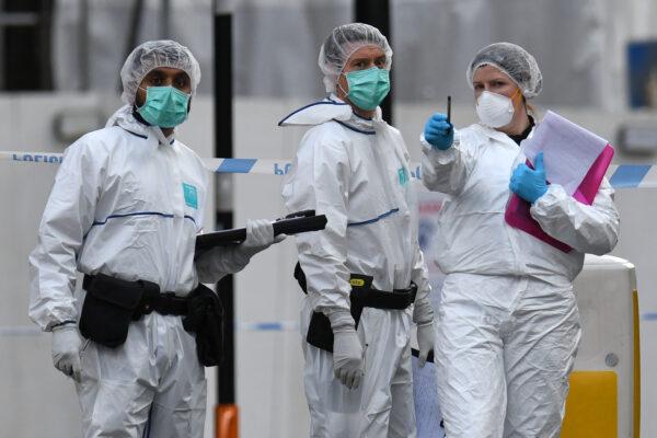 Police forensics officers gather evidence inside a cordon on Hurst Street following a major stabbing incident in the center of Birmingham in central England on Sept. 6, 2020. (Oli Scarff/AFP via Getty Images)