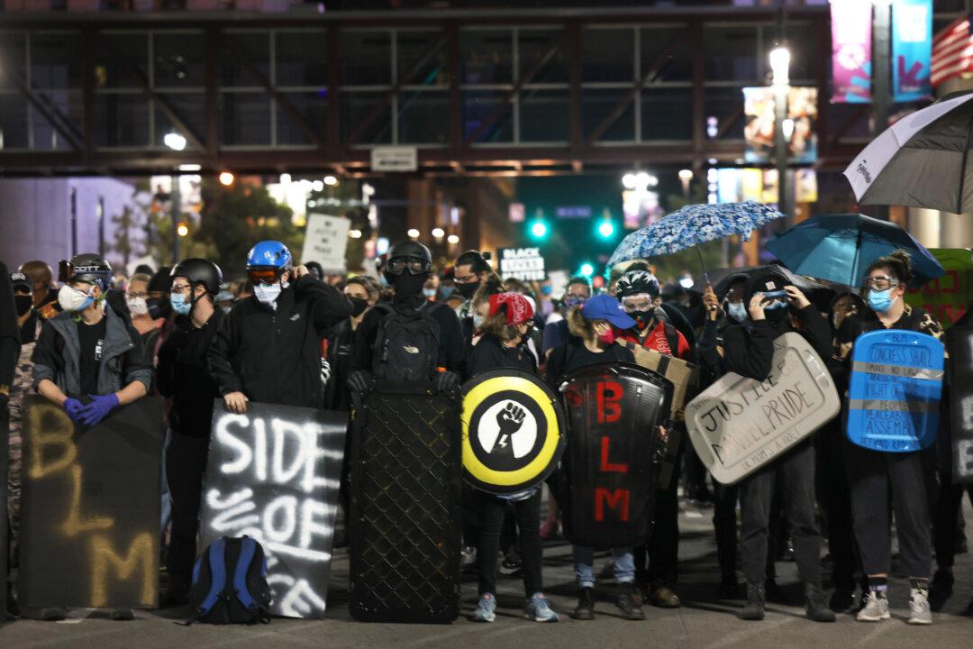 2 Men Charged for Attacking Police Officers During Rochester Riot