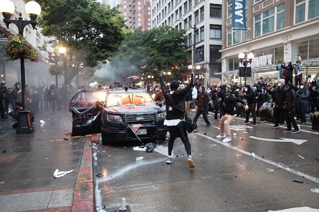 Man Charged With Burning Seattle Police Cars During Seattle Riot