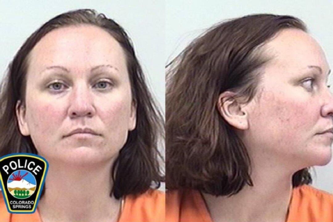 Militia Member Arrested for Allegedly Menacing With Gun During Riot