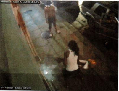 A man wearing a white, sleeveless shirt, identified as Shador Jackson, breaks into Target's headquarters in Minneapolis, Minn., on Aug. 26, 2020. (ATF)
