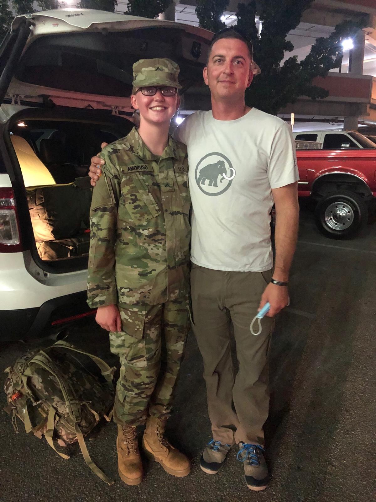 Idaho Army National Guard Pvt. Ashlynn Amoruso poses with her father, 1st Sgt. Dan Amoruso, at the Boise Airport upon returning from Basic Combat Training on Aug. 20, 2020 (<a href="https://www.dvidshub.net/image/6334606/impact-summer-high-school-student-spends-summer-basic-training-preparing-future">Idaho Army National Guard</a>/DVIDSHUB)
