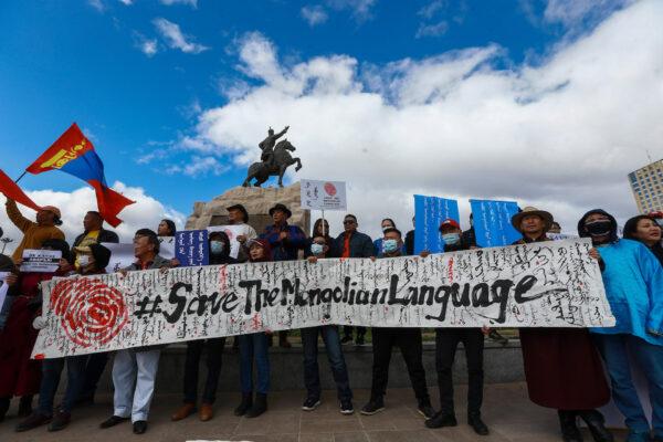 Mongolians protest against China's plan to introduce Mandarin-only classes at schools in Inner Mongolia, at Sukhbaatar Square in Ulaanbaatar, the capital of Mongolia, on Sept. 15, 2020. (Byambasuren Byamba-Ochir/AFP via Getty Images)