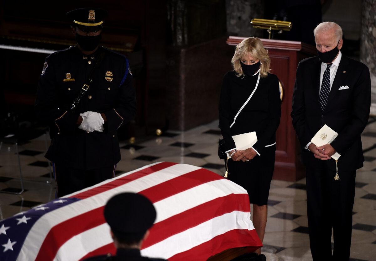 Democratic presidential nominee Joe Biden and his wife Jill Biden pay their respects to the late Supreme Court Justice Justice Ruth Bader Ginsburg as her casket lies in state during a memorial service in her honor in the Statuary Hall of the U.S. Capitol, in Washington on Sept. 25, 2020. (Olivier Douliery/Pool via Reuters)