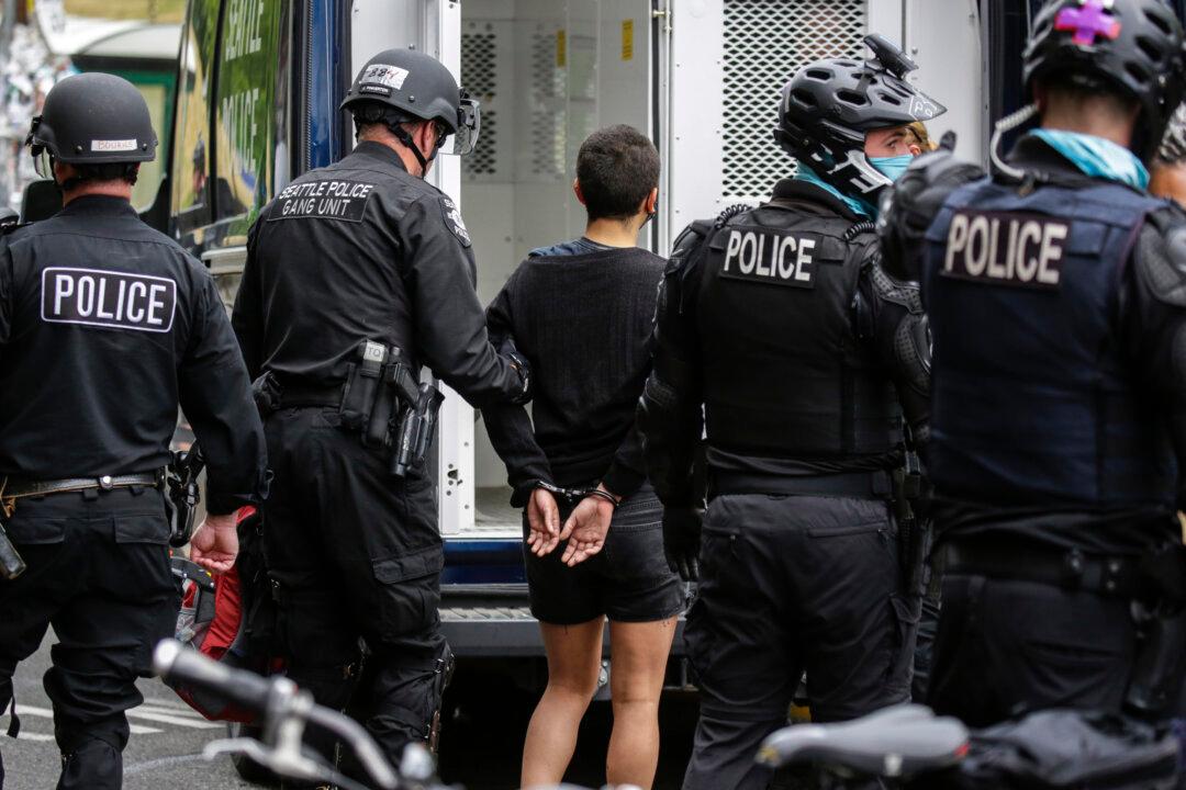 Seattle Police Officer Placed On Administrative Leave After Video Shows Protester Run Over With Bike