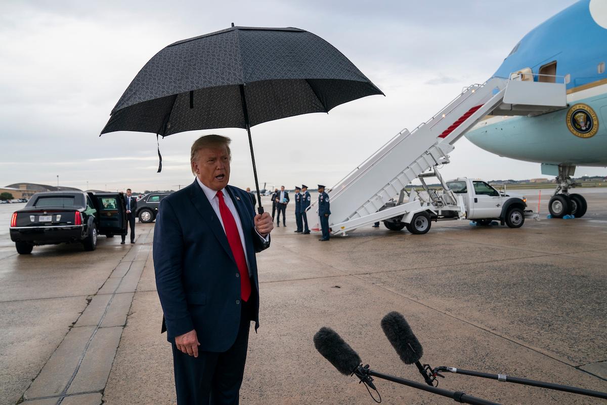 President Donald Trump speaks to reporters at Andrews Air Force Base, Md., as as he returns from campaign stops in Florida and Georgia, Sept. 25, 2020. (AP Photo/Evan Vucci)