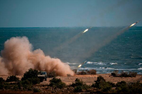 Chinese, Russian, Iranian, Pakistani, and Burmese troops launch rockets from missile systems during the Caucasus-2020 military drills, at the Turali range on the Caspian Sea coast in Russia on Sept. 23, 2020. (DIMITAR DILKOFF/AFP via Getty Images)